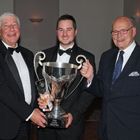 Howden Ganley (L) and John Brindley (R) present Andrew Park with the Lion Trophy